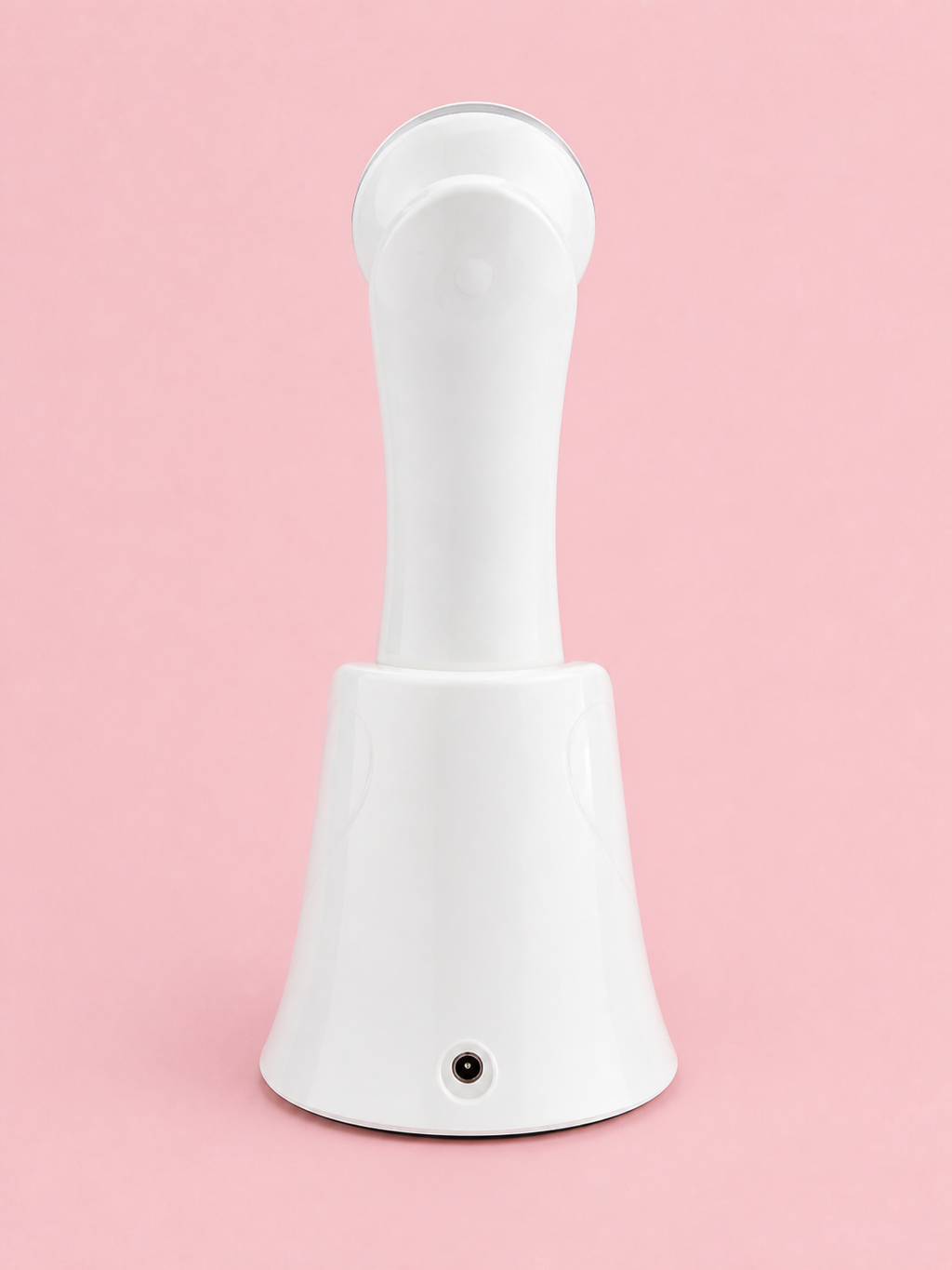 The Solwynn Contour resting in its charging base, seen from behind, with the charging port visible on the base.