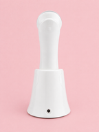 The Solwynn Contour resting in its charging base, seen from behind, with the charging port visible on the base.