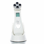 Solwynn Contour facial device resting upright in its charging base on a bathroom counter
